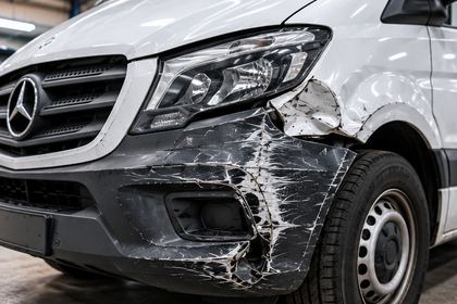 White van with front corner damage
